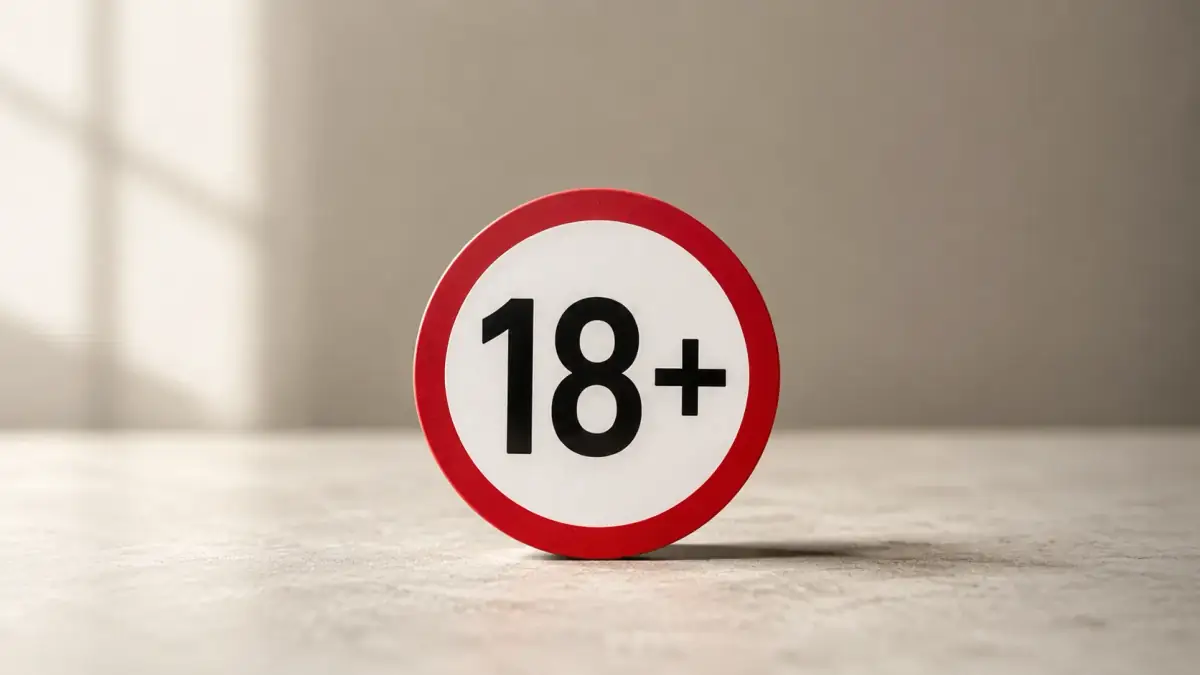 Un semn rotund pe care scrie 18+