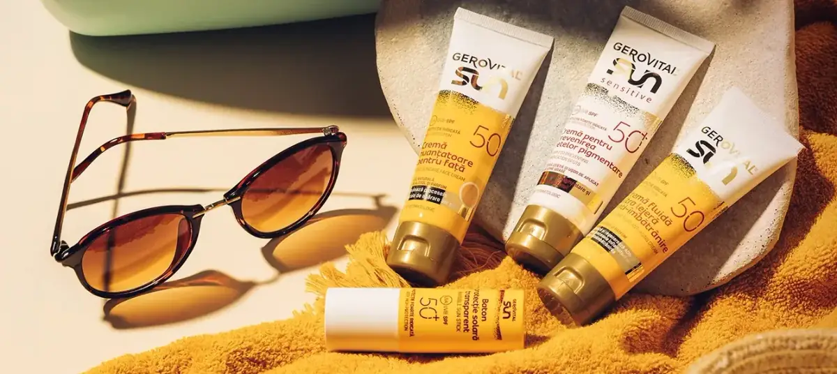 Creme gerovital la promotie pe o plaja langa niste ochelari de soare